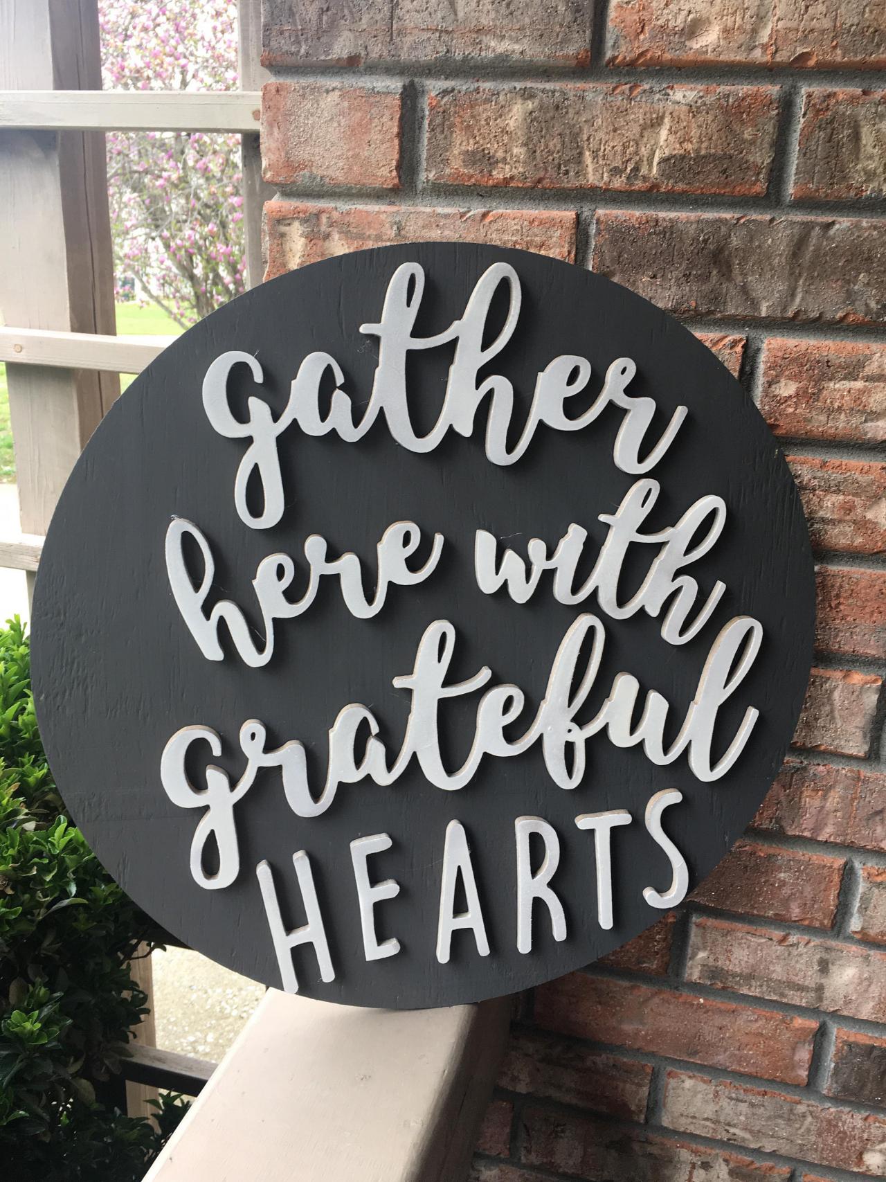 Gather here with grateful hearts. 18 inch round 3D pine wood sign
