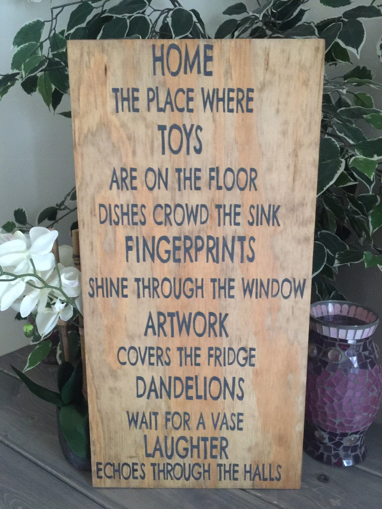 Home the place where toys are on the floor... 12x24 hand painted stained wood sign.