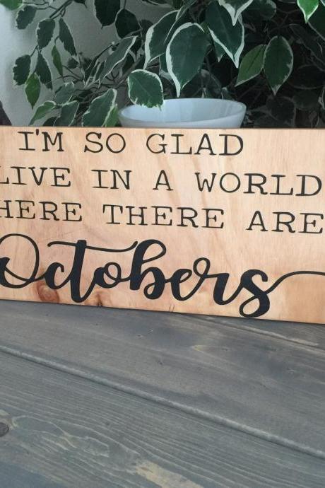 I'm so glad I live in a world where there are Octobers 8x24 hand painted wood sign. Shelf sitter. Fall home decor.